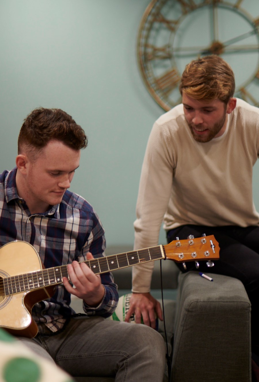 student playing guitar