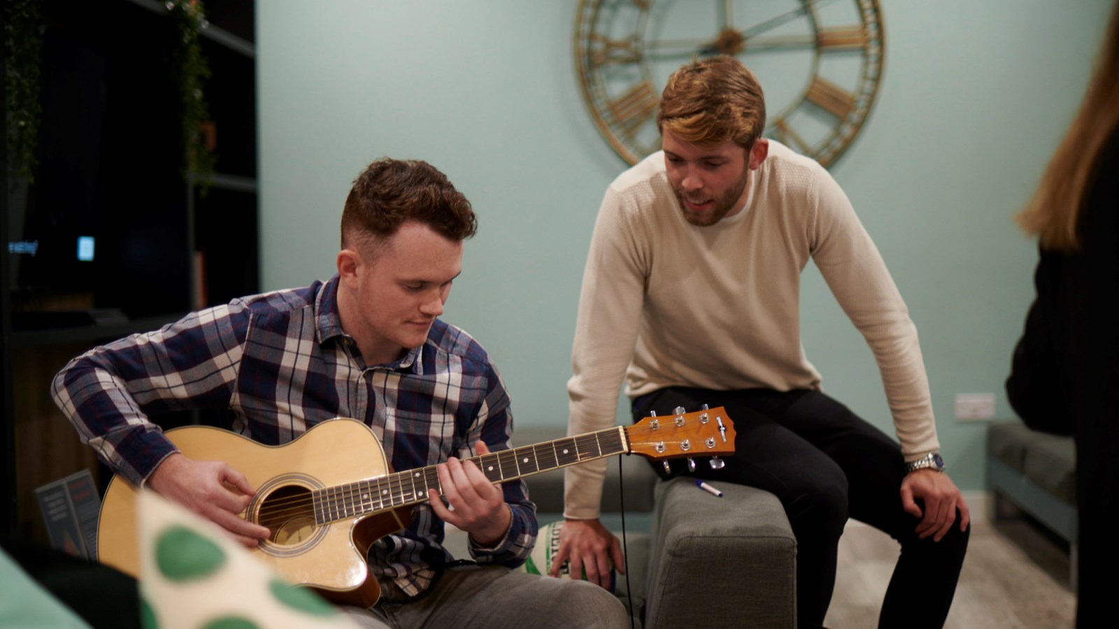 student playing guitar